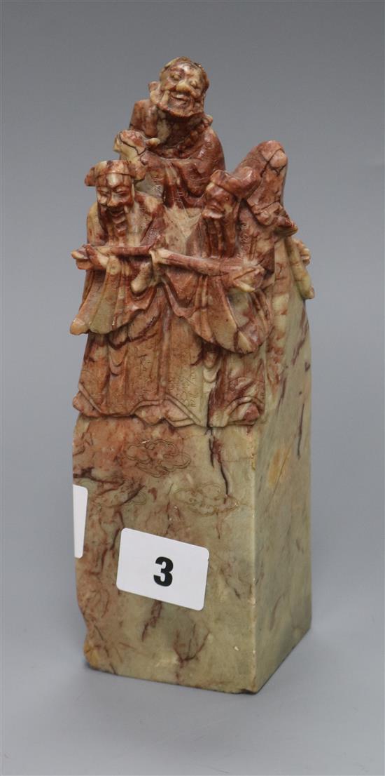 A large Chinese soapstone seal, carved with figures height 20cm